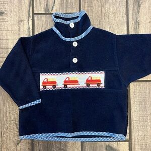 Navy blue smocked fire truck fleece with gingham edging